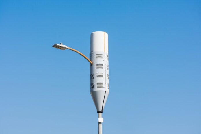 A typical small cell antenna for 5G wireless network installed on lamp post.